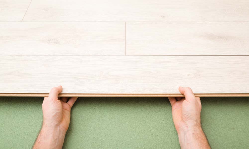 Person laying fibreboard