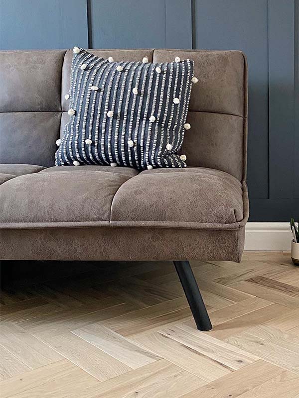 grey sofa, cushion and nazy wall 