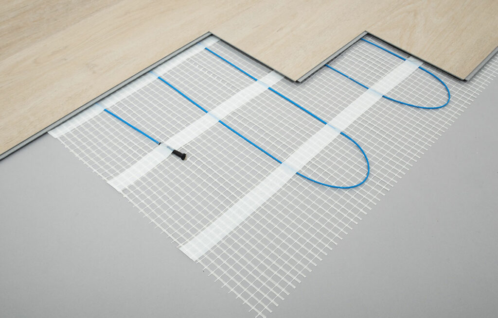 electric underfloor heating cables underneath wood flooring