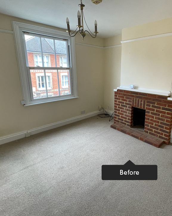 Beige and cream living room with red brick fireplace