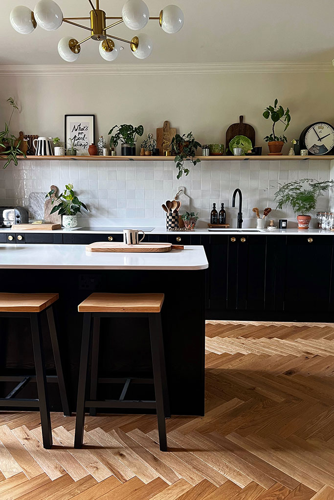 Beautiful monochrome kitchen with white work tops and kitchen island